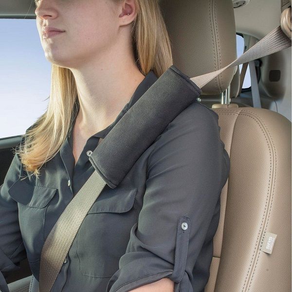 Image showing a closeup of a female model inside a vehicle wearing the product in grey on her shoulder.